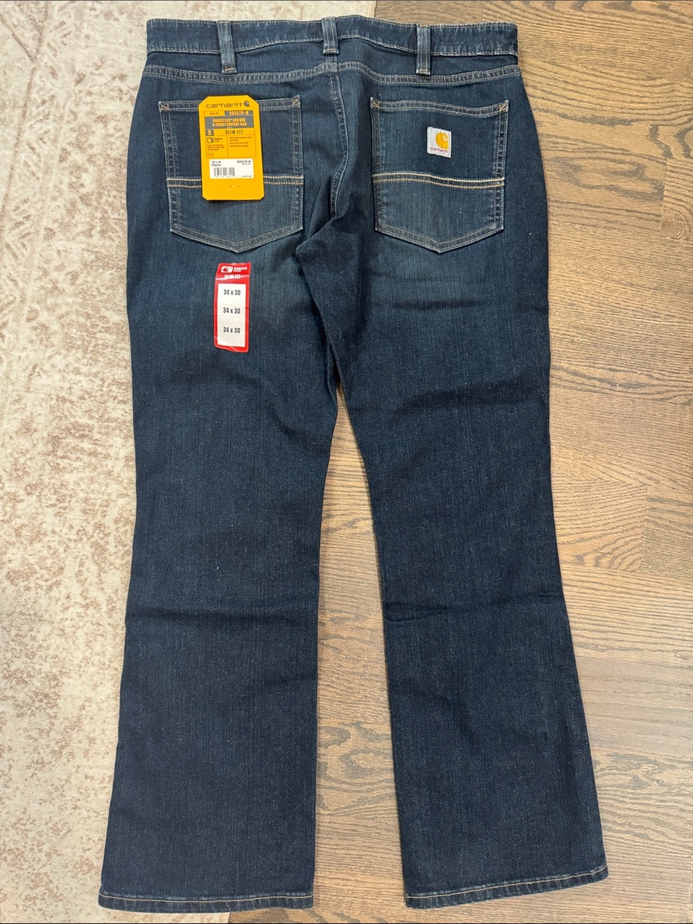 Carhartt Dark Indigo Straight-Leg Jeans with Back Pocket Logo Patch